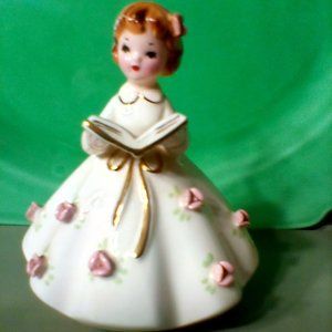 Vintage Beautiful Girl reading hymn book